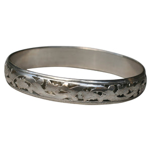 The zirconmania-1 Vintage Artisan Filigree Bangle (532B23336) features lovely electroplated swirls in an elegant, vintage-inspired design.
