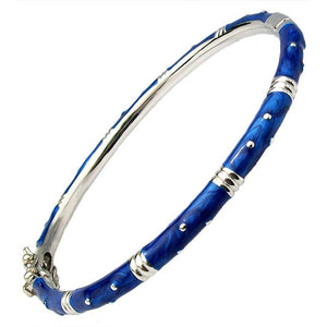 The zirconmania Bracelet Thin Gold tone Enamel Bangle 501B5339 is a slim gold-tone bangle with a blue enamel finish, silver accents, and small silver dot details, shown against a white background.