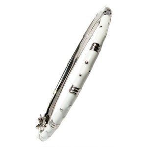 The zirconmania Bracelet Thin Gold tone Enamel Bangle 501B5339 is a slim, round white enamel bracelet with small silver dots and gold-tone accent bands, displayed at an angle on a plain white background.