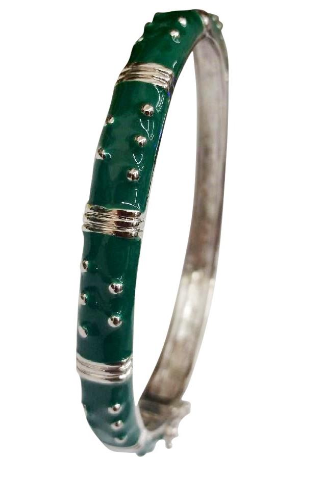 The zirconmania Bracelet Hinged Enamel Bangle 501B41902 is a silver bracelet with glossy green enamel, raised silver dots and bands, and a secure safety catch.