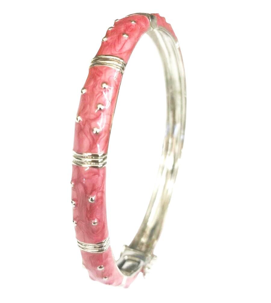 The zirconmania Bracelet Hinged Enamel Bangle 501B41902 features pink marbled enamel sections, raised silver studs, and horizontal bands. This silver bangle has a hinged design and discreet safety catch for easy, secure wear.