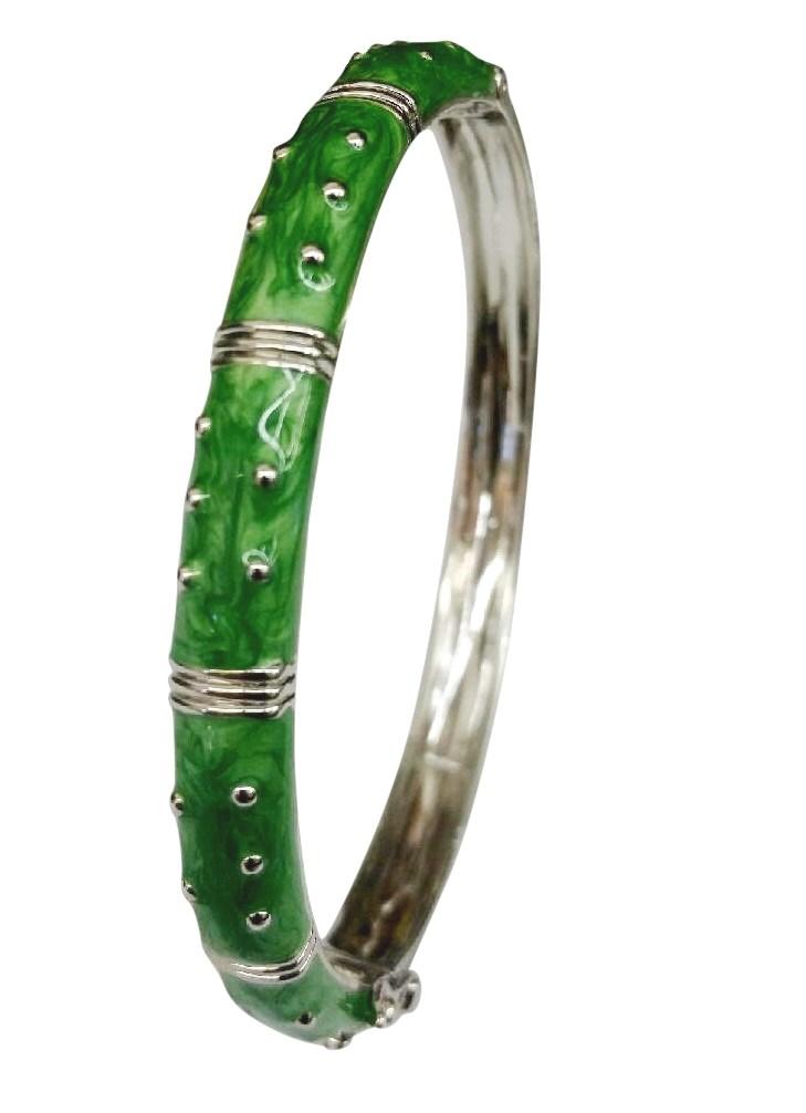 The zirconmania Bracelet Hinged Enamel Bangle 501B41902 features a silver finish with a green bamboo-style enamel, raised silver dots and segments, offering striking style and easy wear.