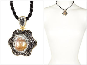 Designer pendant w/hinged bail top enhanced with large Free-form Biwa pearl in the center, embellished by clear and black diamond crystals 543P105