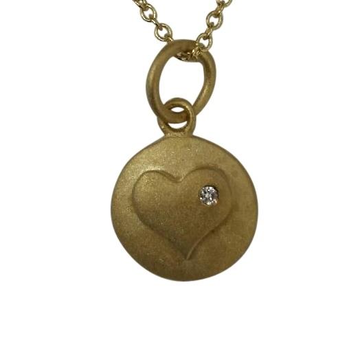 Round matte finish pendant featuring a Zirconite Cubic Zirconia in heart