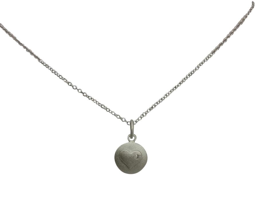Pendant Round matte finish featuring a  in heart Sterling Silver. 582P2345