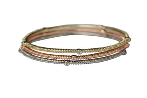 The zirconmania Bracelet Three Designer Bangles 622B0166x3 set features gold, rose gold, and silver-toned textured bangles with sparkling crystal accents, displayed on a white background.
