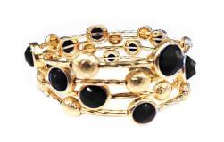 The zirconmania Bracelet Multi-Wire Gold and Beads Bangle 22B0241A features intertwined gold bangles accented with round black and gold beads for a stylish, layered look.