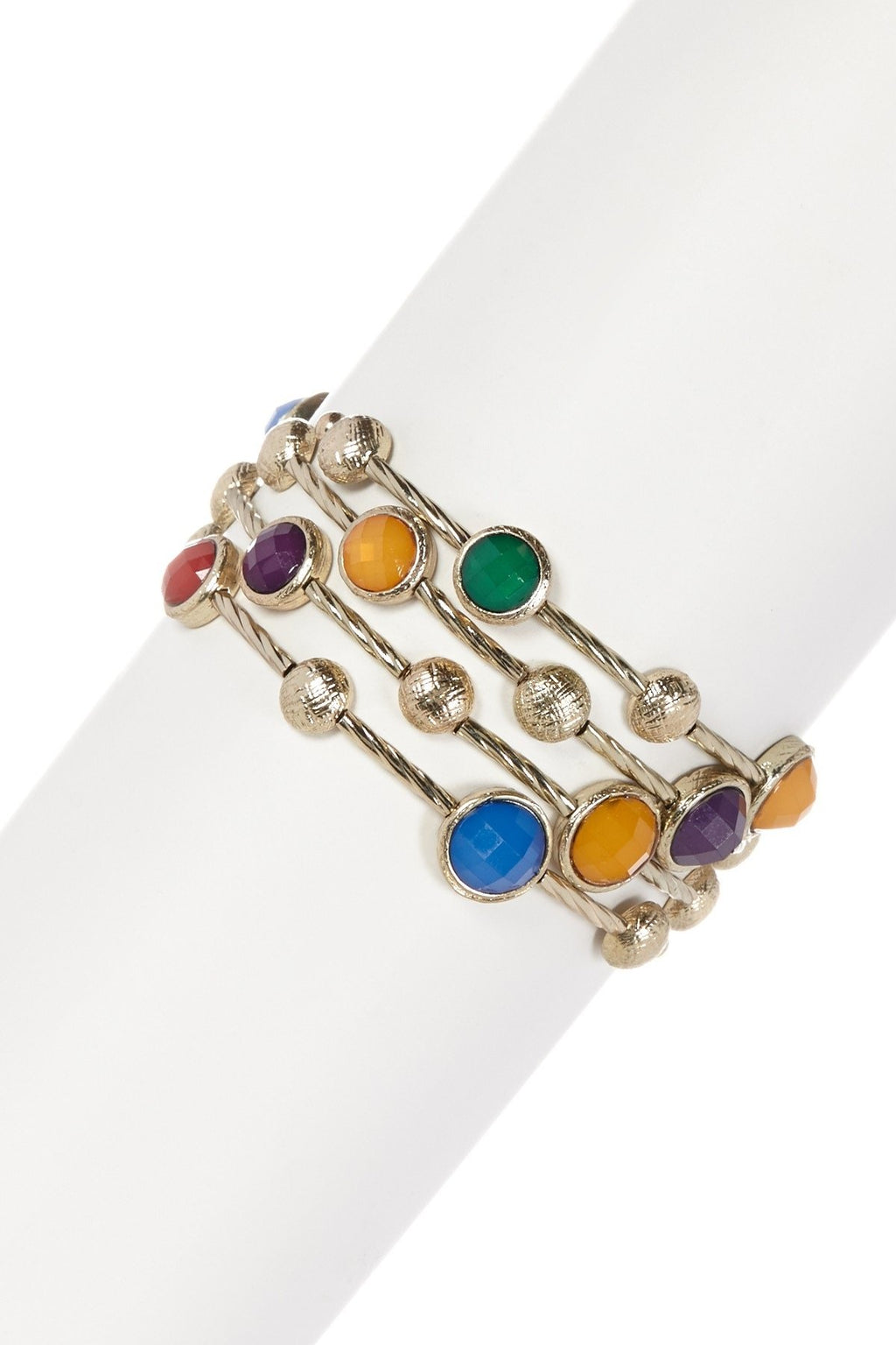 The zirconmania Bracelet Multi-Wire Gold and Beads Bangle 22B0241A showcases round red, purple, green, blue, and orange gemstones with textured gold beads, elegantly displayed on a white cylindrical stand.