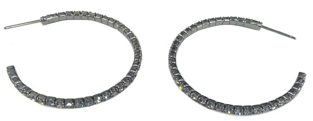 A pair of zirconmania Earrings 2 mm Electroplated Feather weight Hoop . 637E14302, each adorned with square-cut clear stones along the outer edge, displayed on a white background.