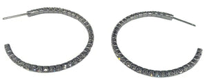 A pair of zirconmania Earrings 2 mm Electroplated Feather weight Hoop . 637E14302, each adorned with square-cut clear stones along the outer edge, displayed on a white background.