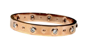 The zirconmania Bracelet 655B1045 is a wide, high-polished stainless steel hinged bangle.