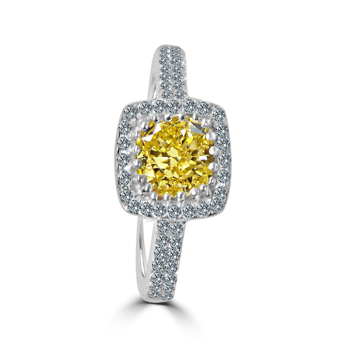 The zirconmania Ring 1CT Cushion Radiant Center w/Halo Pave CZ Sterling Silver (705R0251) features a cushion-cut yellow gemstone with a halo and band of sparkling pave CZ diamonds, displayed on a white background.
