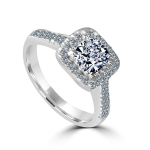 The zirconmania Ring 1CT Cushion Radiant Center w/Halo Pave CZ Sterling Silver Ring 705R0251 features a cushion radiant center stone with a square halo and pave-set CZ stones along the band.