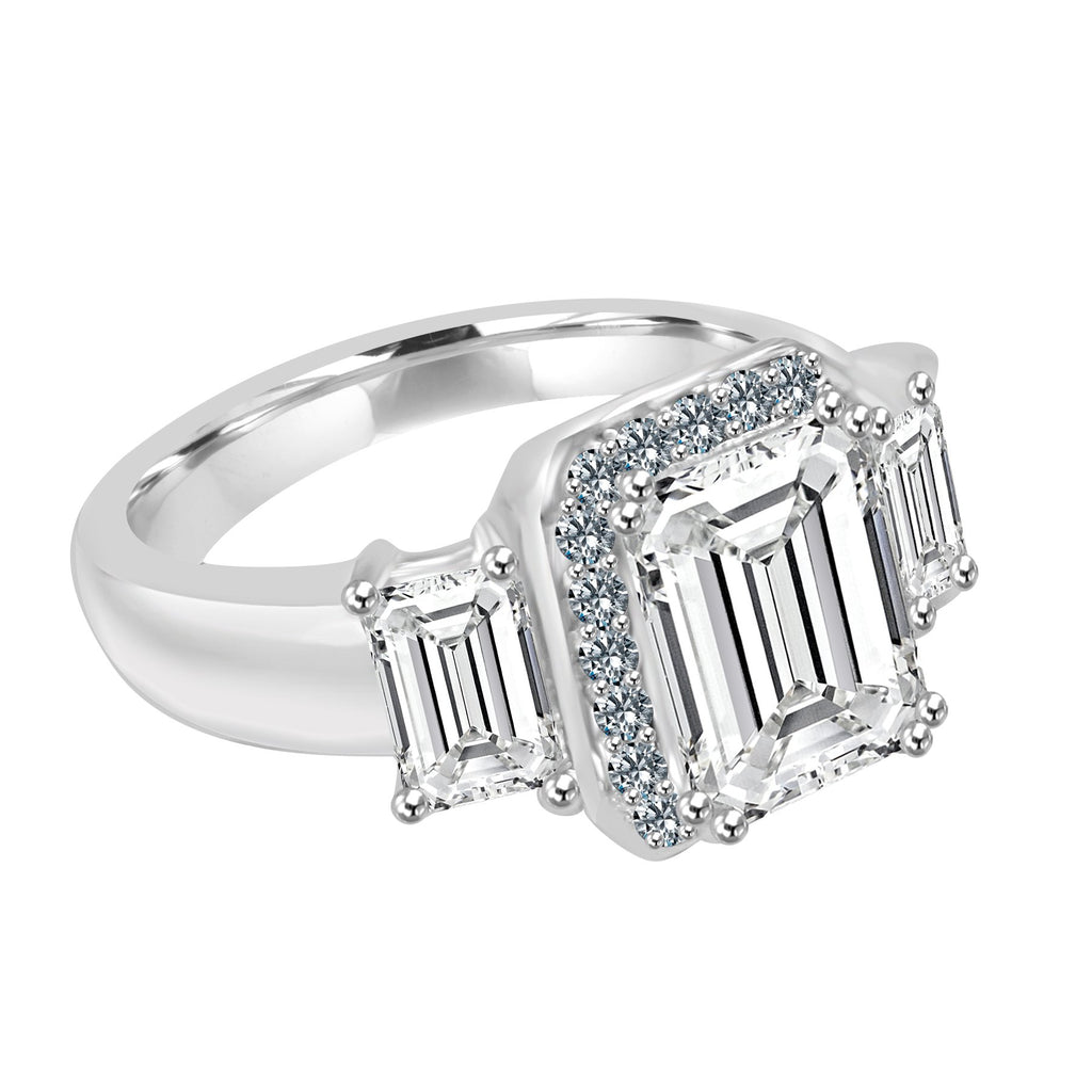 Ring 9X7 Em Cut Ctr Cz 6X4 Em Side Cz's