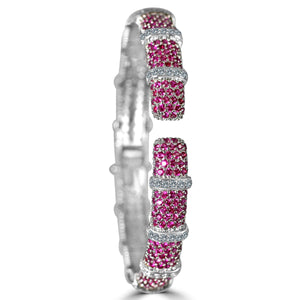 The zirconmania Bracelet Face-off line Stations wide fine Cubic Zirconia Set Hinged Bangle 698B100 features clusters of round pink stones and five sections of sparkling clear zirconia, creating a luxurious and elegant pattern.
