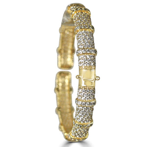 The zirconmania Bracelet Face-off line Stations wide fine Cubic Zirconia Set Hinged Bangle 698B100 features a secure clasp and textured, segmented design with rows of sparkling cubic zirconia stones.