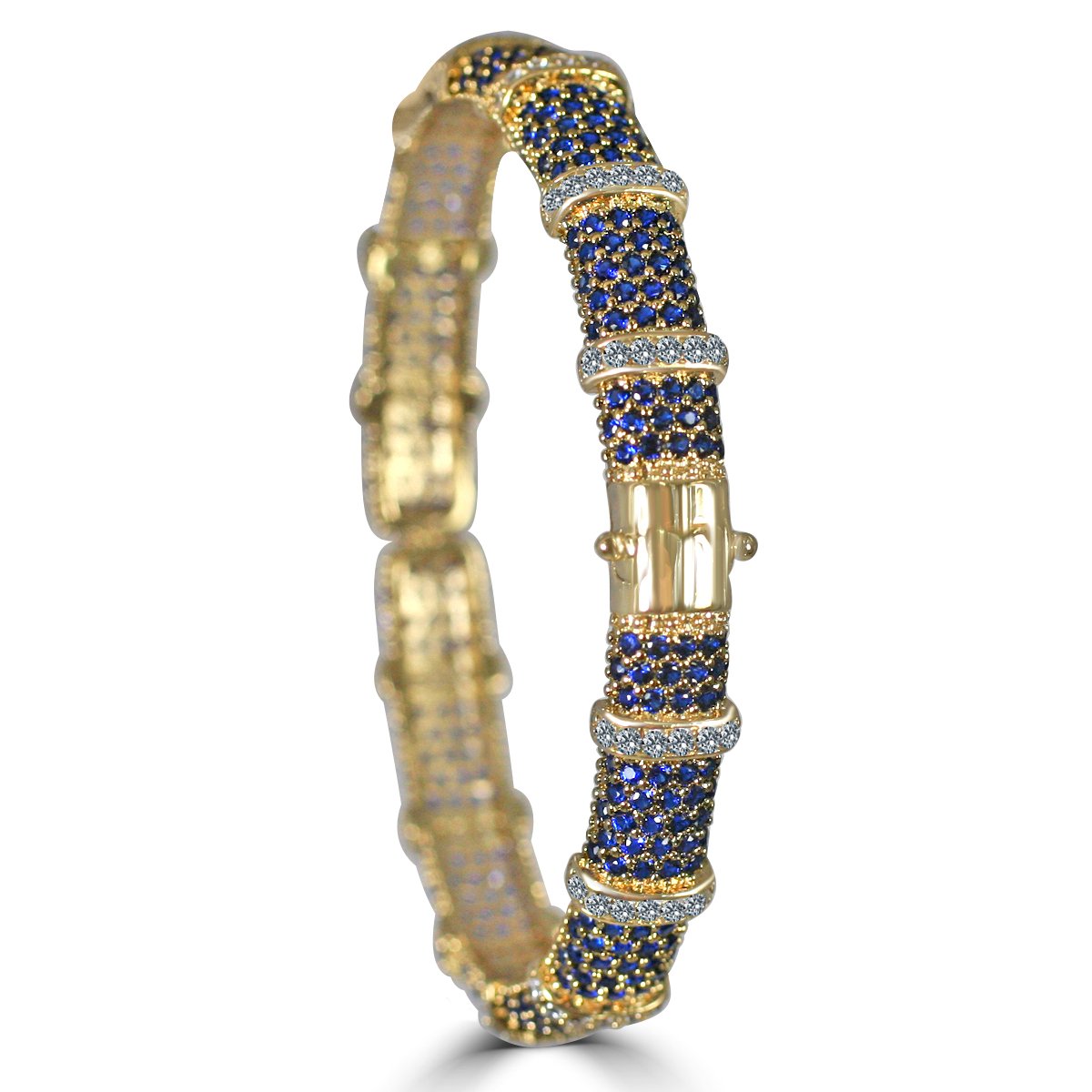 The zirconmania Bracelet Face-off line Stations wide fine Cubic Zirconia Set Hinged Bangle 698B100 features alternating blue and clear cubic zirconia in a bold patterned design, with a seamlessly integrated clasp.