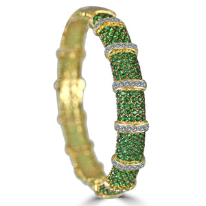The zirconmania Bracelet Face-off Line Stations Hinged Bangle 698B100 features a wide, segmented design with clusters of fine green gems and bands of sparkling cubic zirconia.