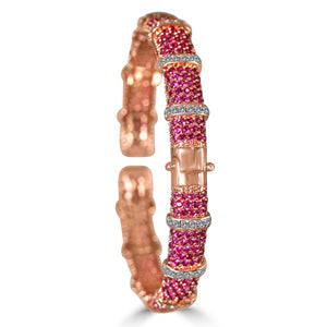 The zirconmania Bracelet Face-off line Stations wide fine Cubic Zirconia Set Hinged Bangle 698B100 features a rose gold finish, pink gemstone rows, clear zirconite accents, and a central clasp.
