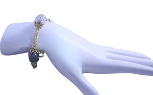Gold chain toggle bracelet with black diamond and clear crystal studded barrel shape stations 661B1001