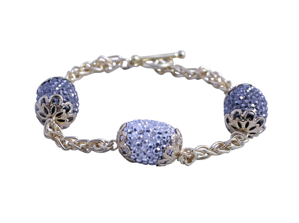 Gold chain toggle bracelet with black diamond and clear crystal studded barrel shape stations 661B1001